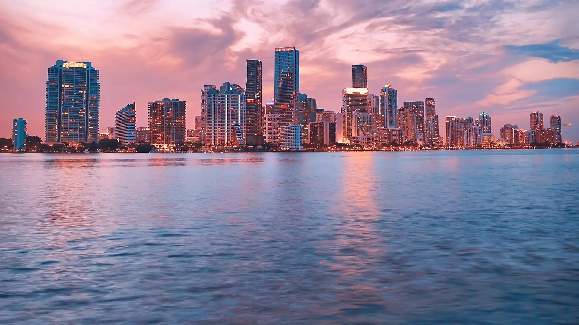 Miami skyline across Biscayne Bay at dusk